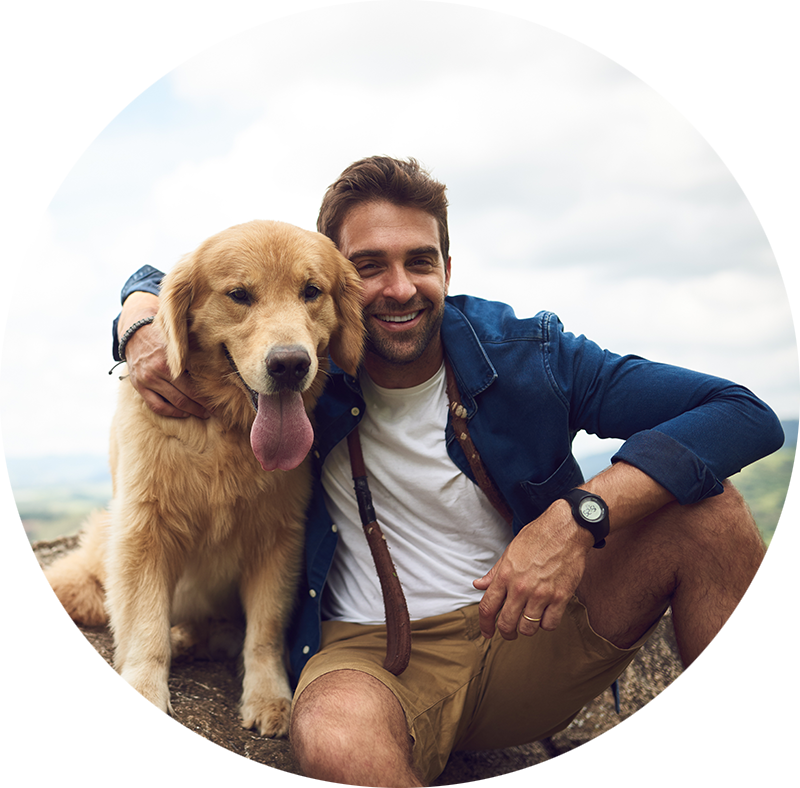 the same man and his dog at the beach.