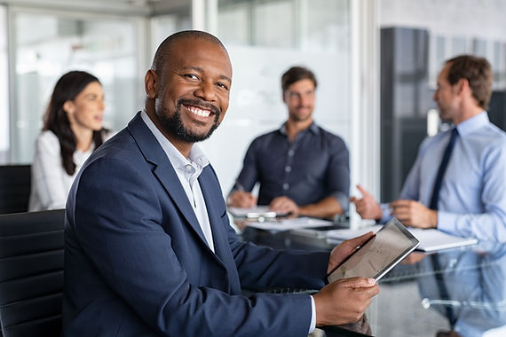 happy office workers at a table.